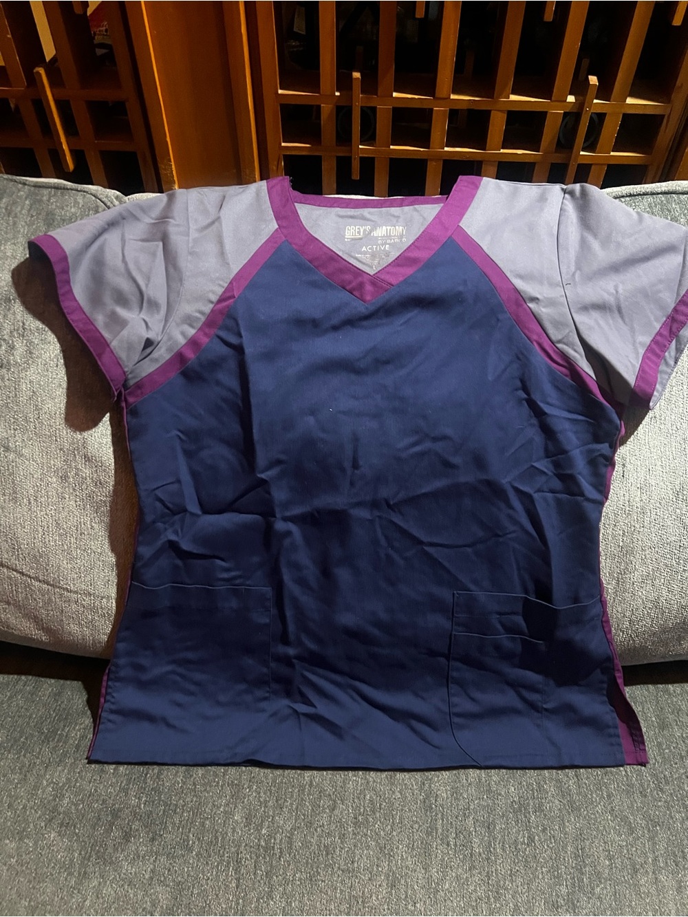 Grey's Anatomy Navy Top with Purple Trim & Light Gray Sleeves